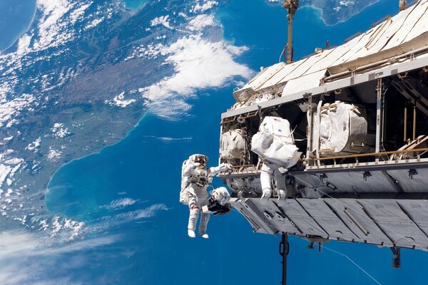 Astronauts working in outer space