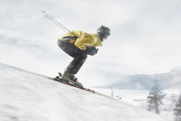 A skier goes down a snowy slope