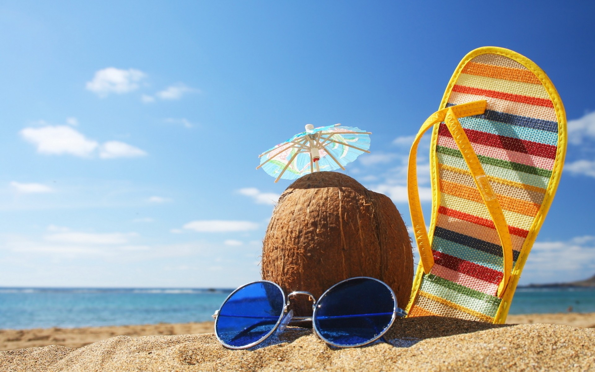 summer beach sand vacation seashore sea sky ocean travel sun water tropical relaxation nature leisure shore resort fair weather sunny objects glasses shoes