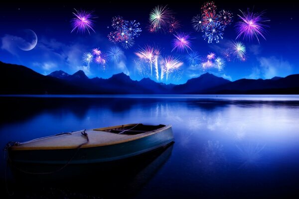 Boat on the lake under the moon. Fireworks in the night sky