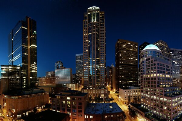 A big city at night with skyscrapers