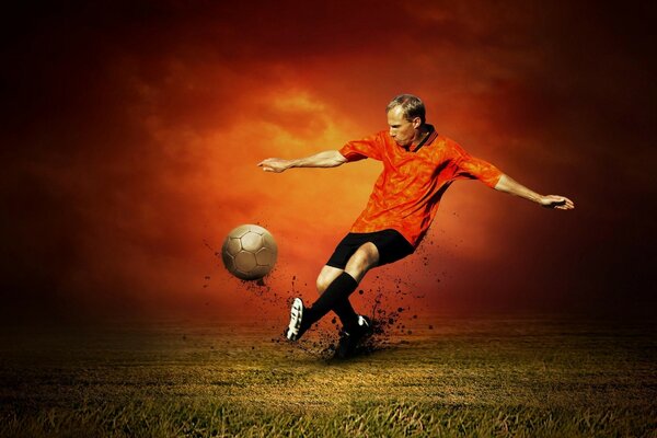 Futbolista en el campo patea la pelota