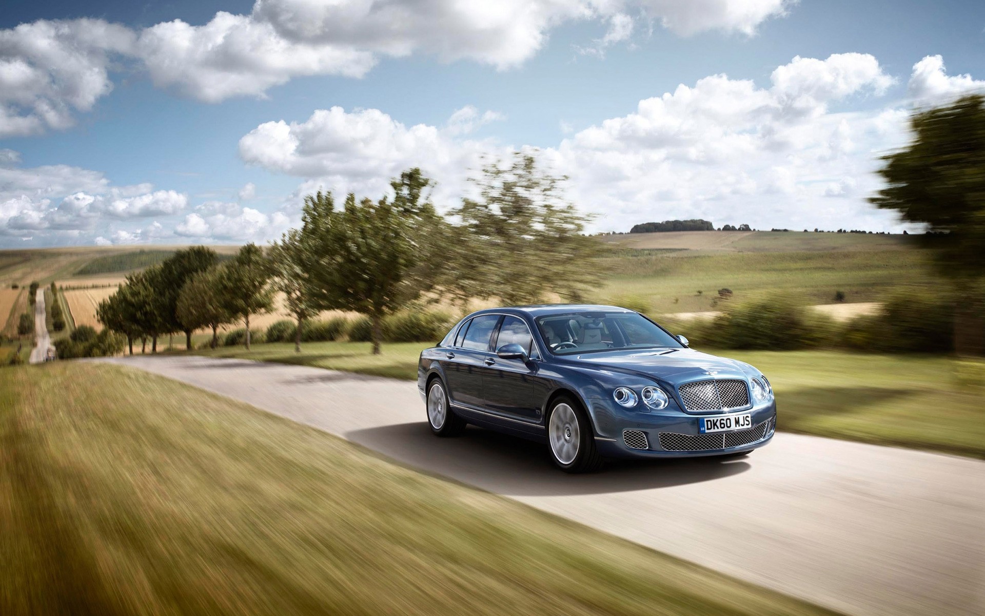 bentley voiture route voiture lecteur asphalte paysage noir chaussée système de transport action herbe dépêchez-vous golf voyage flou bentley flying spur