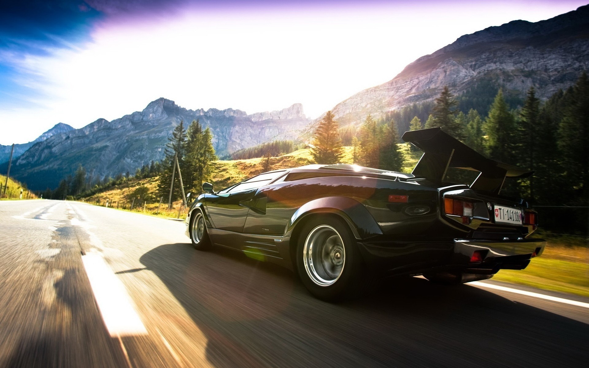 lamborghini voiture route système de transport voiture asphalte voyage dépêchez-vous noir flou montagnes autoroute paysage lumière lecteur rapide voitures vintage vitesse sport