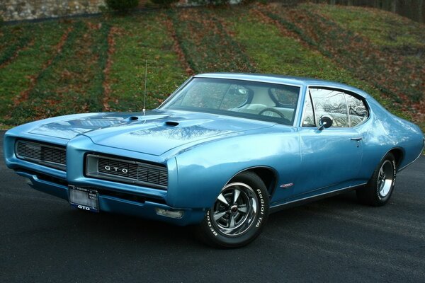 Blue retro car on asphalt