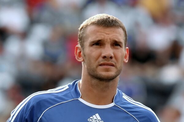 A famous football player in a crowded stadium