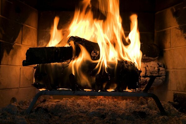 Cozy flame in the fireplace at home