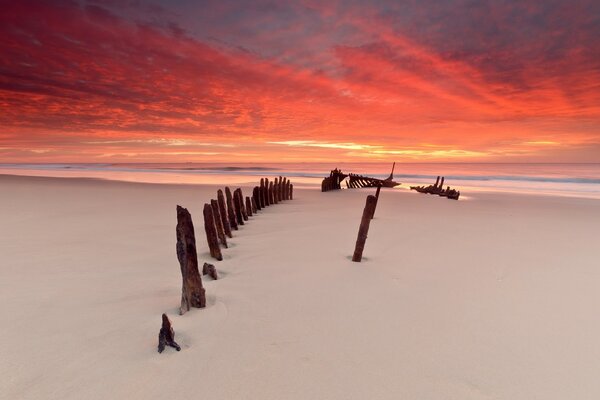 The remains of an ancient seaworthy regatta, the skeleton of a boat covered with white sand