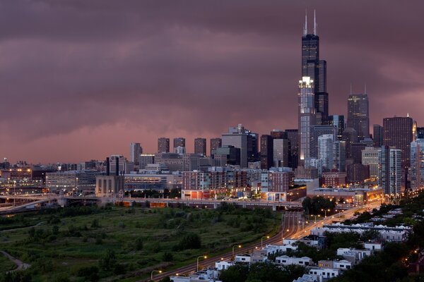 Night skyscrapers with a green park