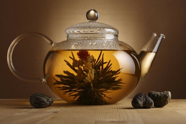 Glass teapot on the table