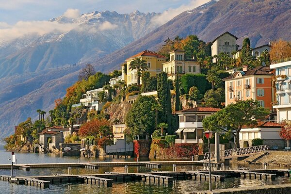 A city near the water on a mountain slope