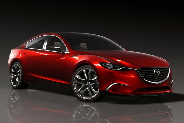 Mazda rouge sur un sol gris brillant