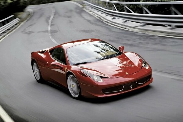 A red Ferrari car racing across the bridge