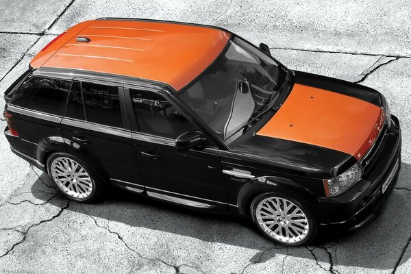 Range rover sport orange haut craqué sur les plaques