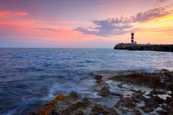 Paisagem do pôr do sol no farol