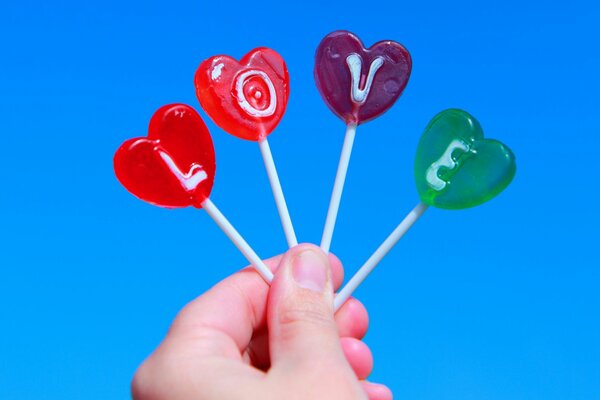 Colorful lollipops with the inscription love