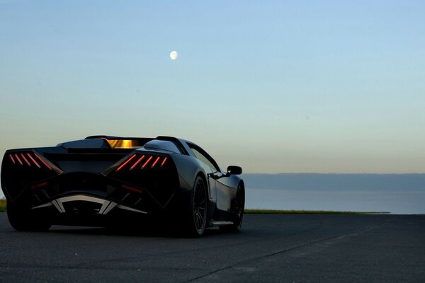 Sports car on the background of the evening sky