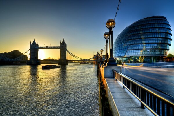 View from the pier to the sunset behind the bridge