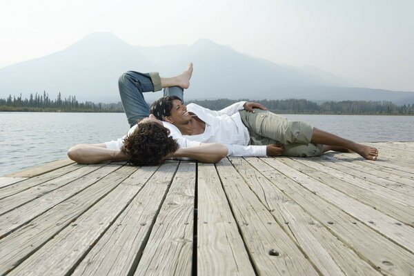 A couple in love is resting by the lake