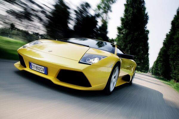 Yellow sports car driving on the road