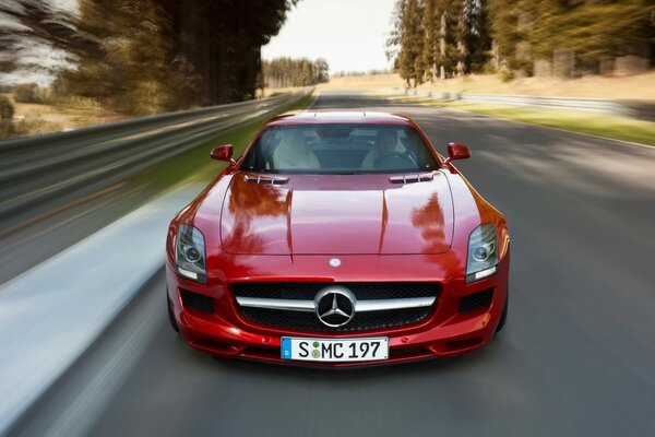 Red Mercedes on wet asphalt