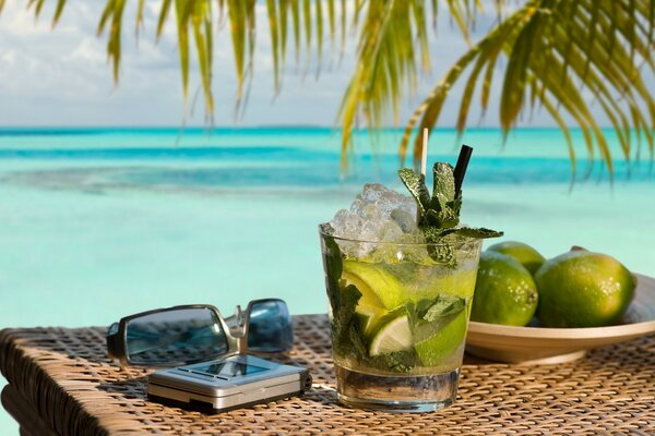 Table with items on vacation by the sea