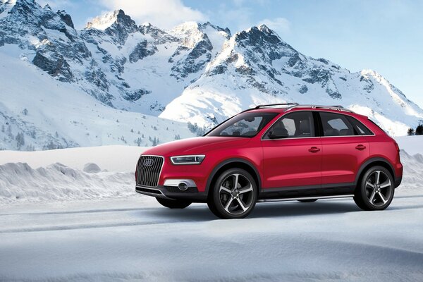 Mountains and a red Audi passenger car