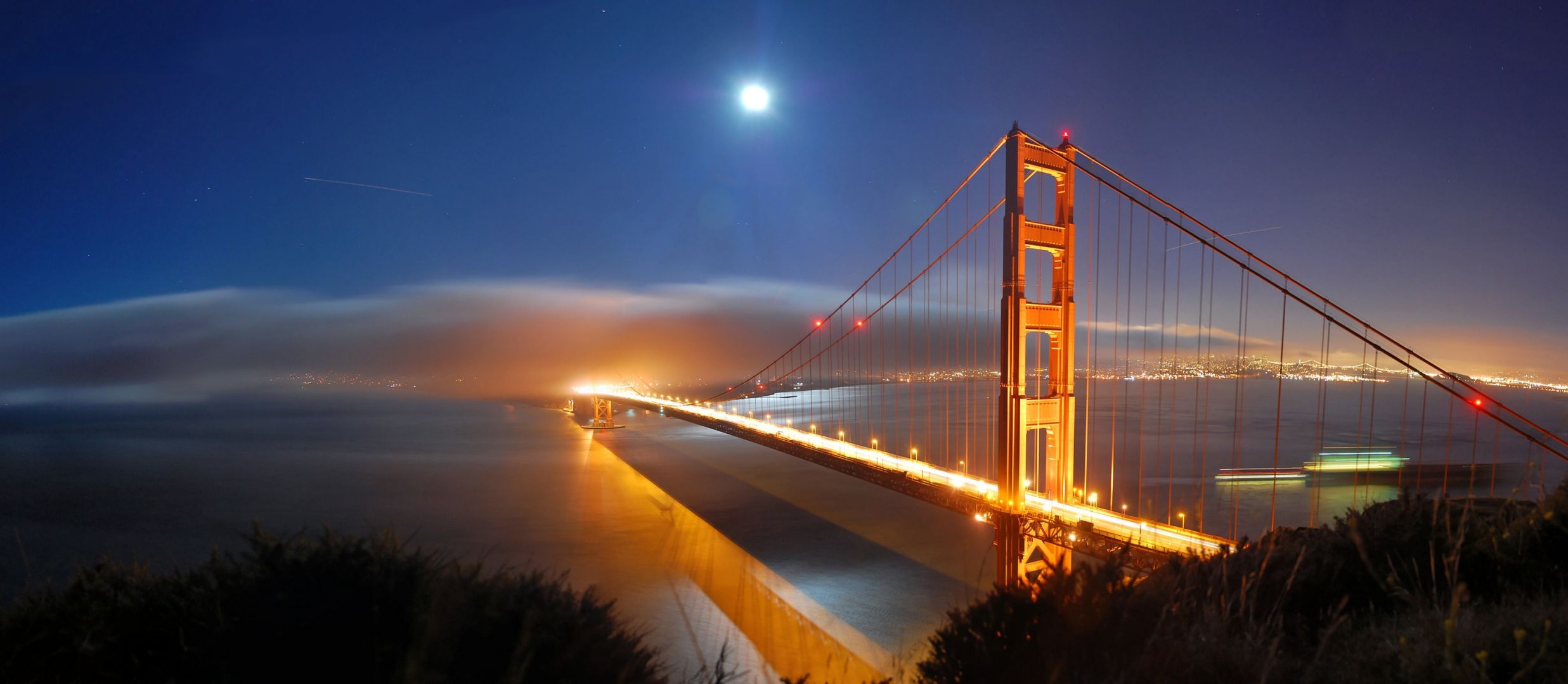 bridges bridge sunset water dusk evening architecture travel sky river city suspension bridge transportation system dawn reflection