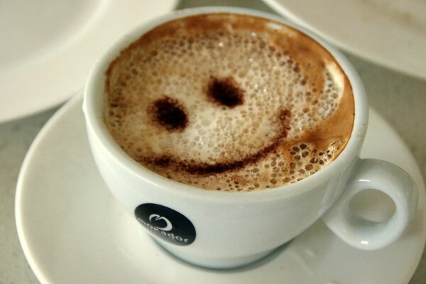 A smiley face was drawn in a cup of coffee