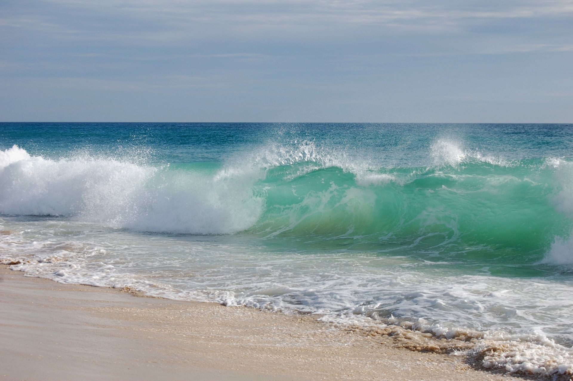 sea and ocean surf water beach sea wave ocean summer seashore foam sand sky travel fair weather sun seascape splash nature