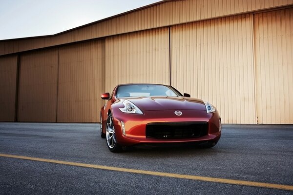 Red Nissan on the asphalt