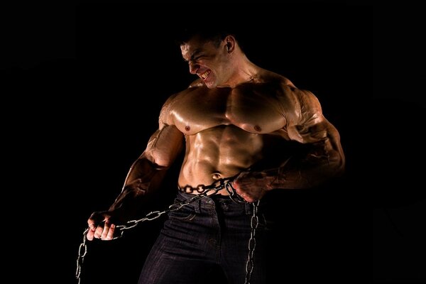 A pumped-up young man with a chain