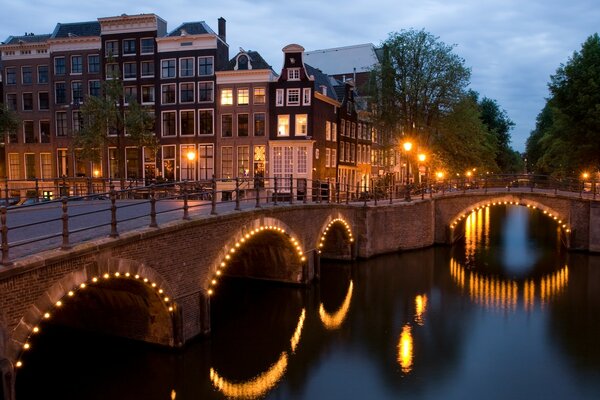 Evening illumination of the river bridge