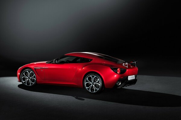 Red aston martin on a dark background