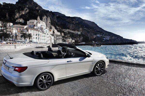 Convertible car on the seashore