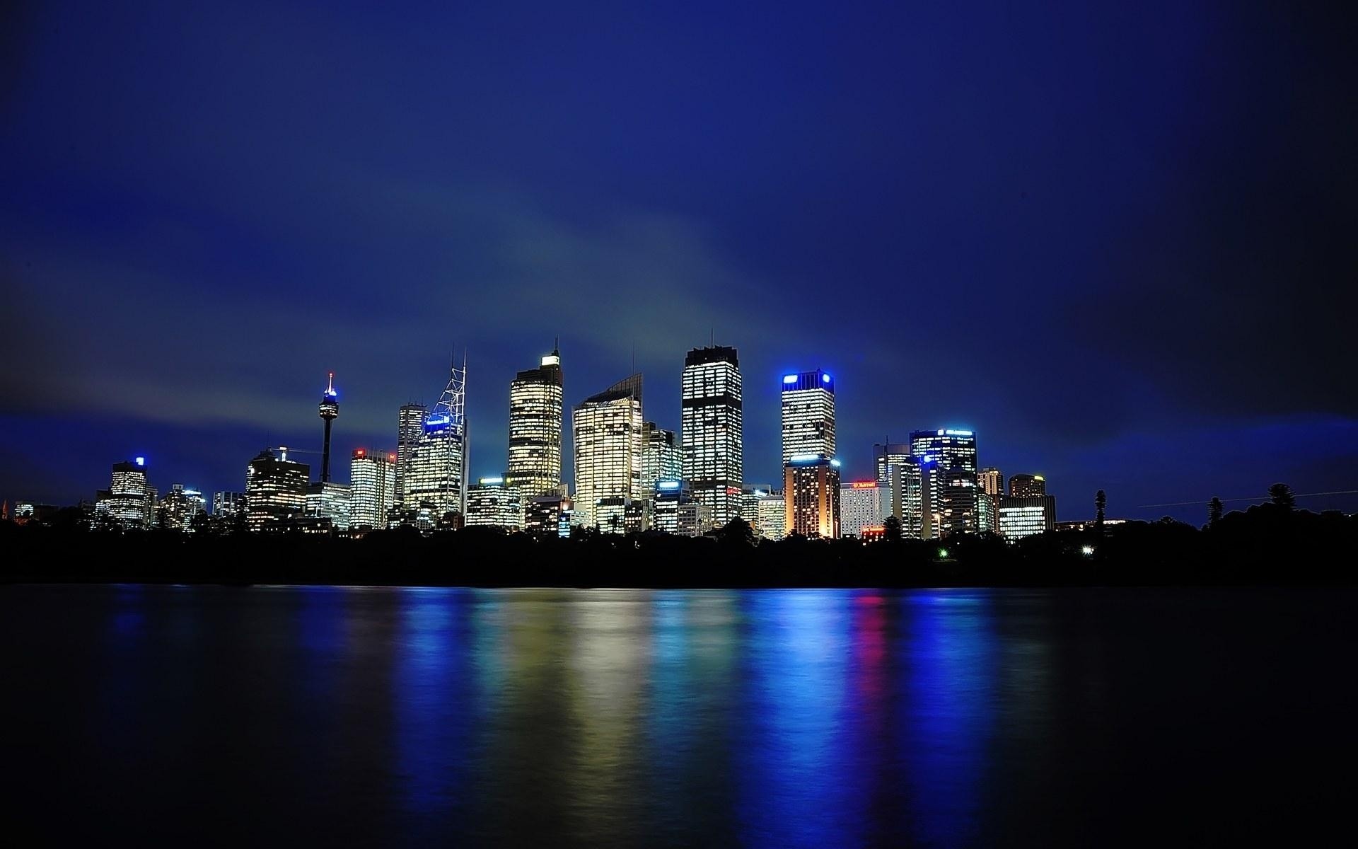 australia city skyline cityscape architecture downtown dusk skyscraper river water sky evening reflection building waterfront sunset office travel harbor business bridge