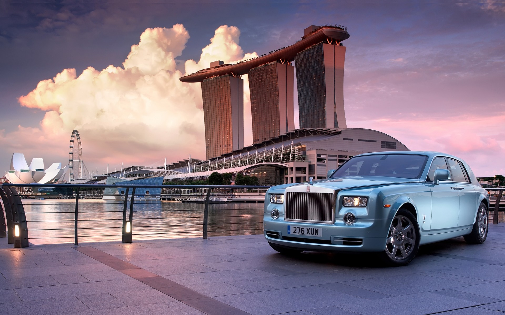 rolls royce vehicle architecture travel transportation system water bridge city sunset sky car building dusk outdoors downtown business urban