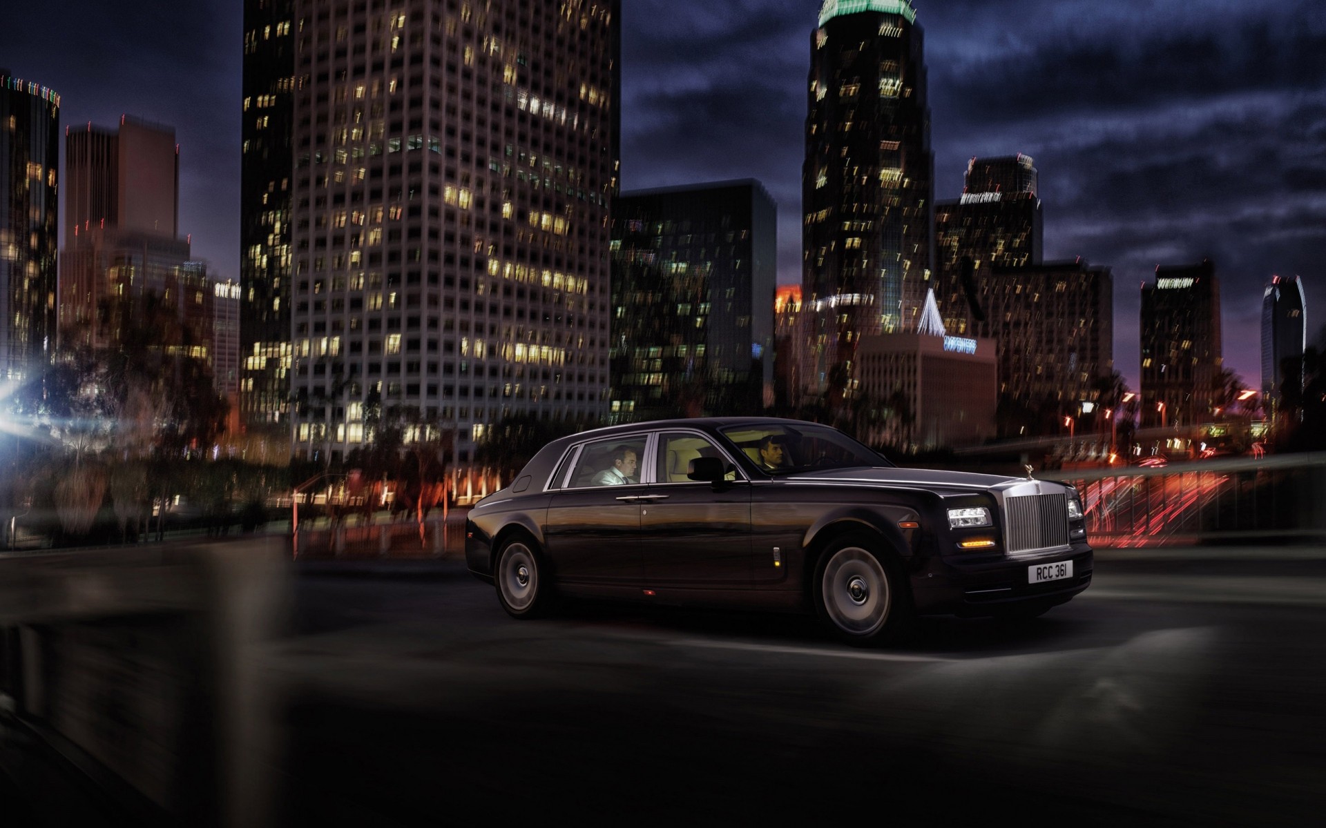 rolls royce city car downtown street road skyscraper building traffic cityscape travel skyline urban light dusk blur business architecture evening transportation system