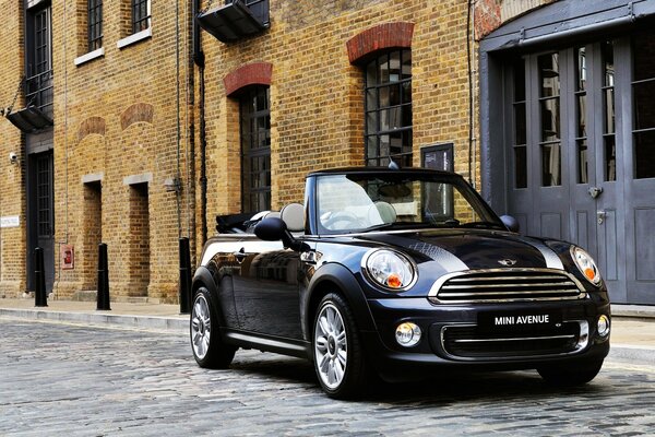 Black mini Cooper convertible on the street