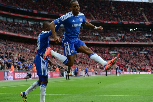 A football player bounces on a football background