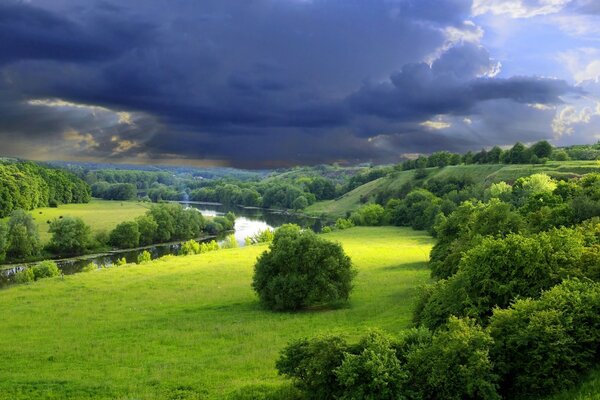 The river is lost among the green hills