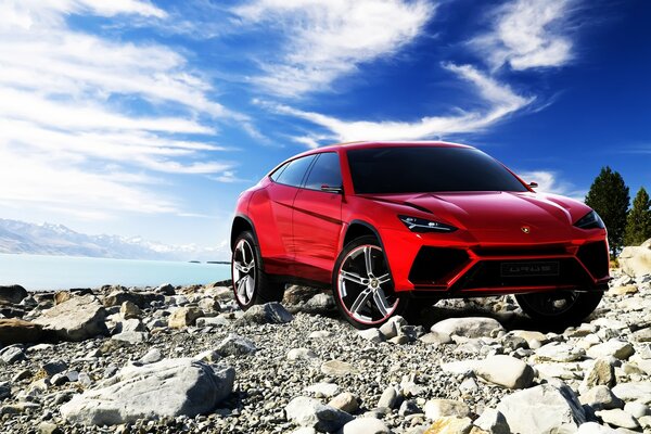 Red car on the river bank