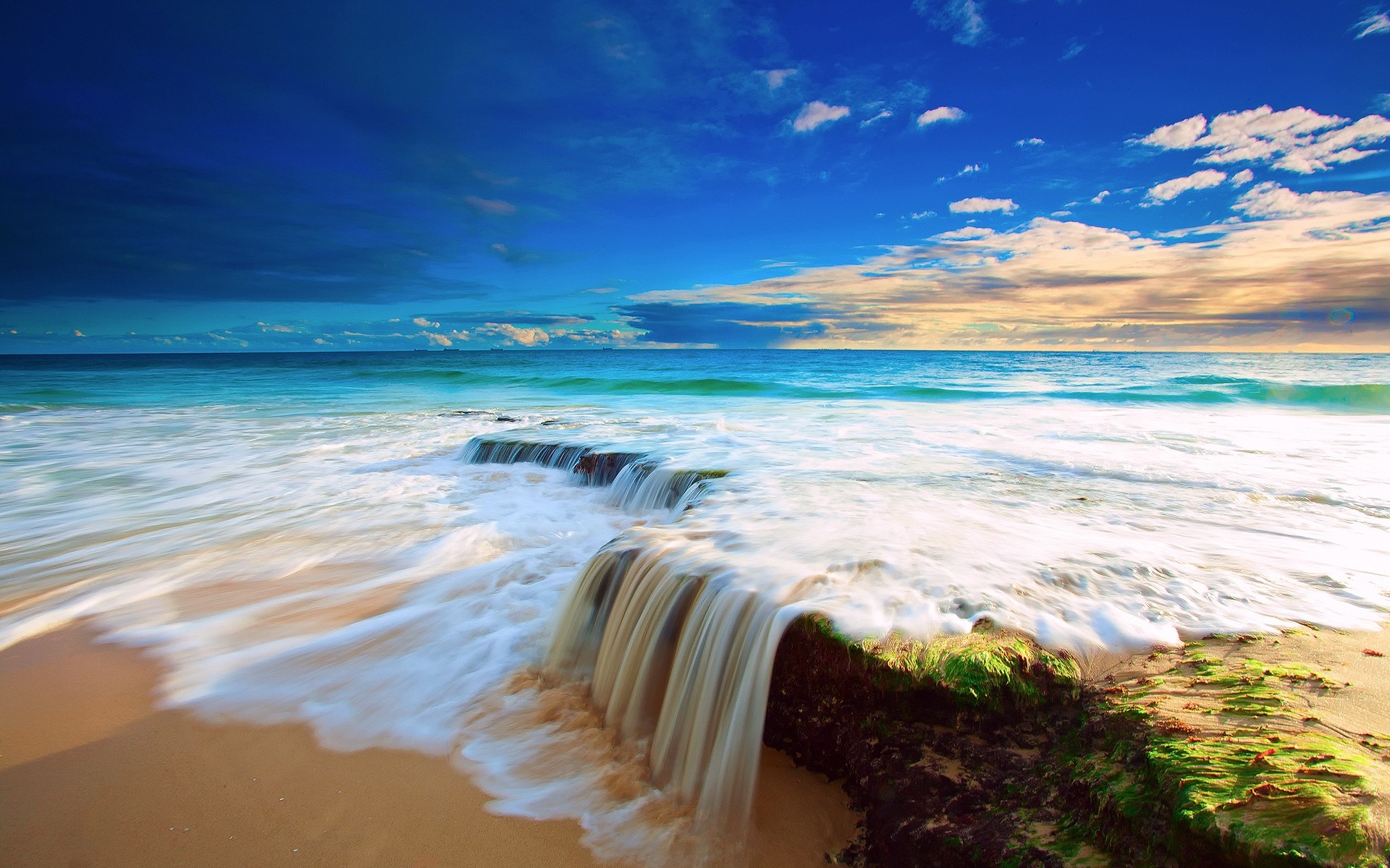 landscapes water beach sand ocean travel seascape sea seashore surf sun tropical sky sunset summer fair weather island vacation wave nature sea waves sea landscape background blue sea