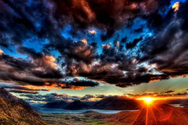 Sunset landscape against the background of rain clouds