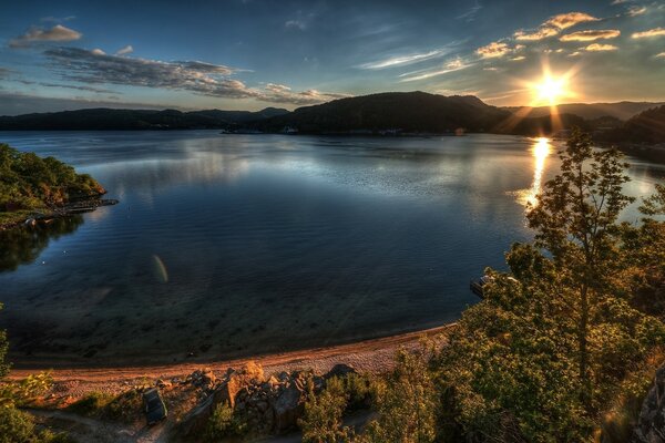 A beautiful sunset is reflected in the water