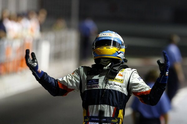 A man in a helmet gloves and a suit