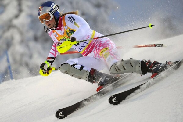 A skier on the descent from a mountain slope