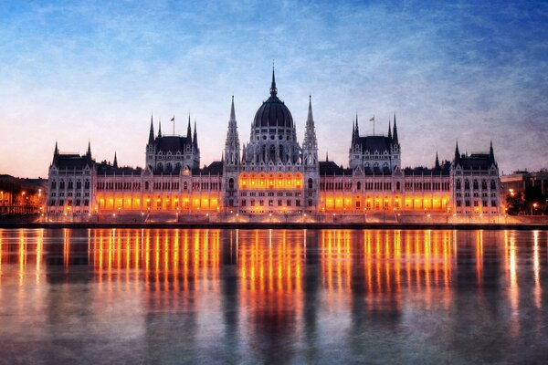 The evening castle merges with the river