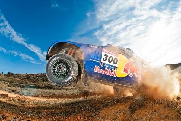 Sports car flying off-road against the sky