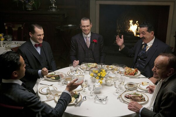 A group of men sitting at a table